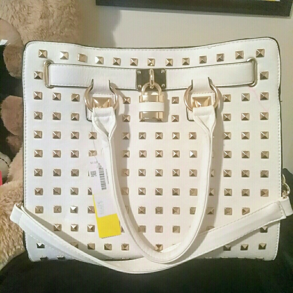 NWT..white purse with gold design in front.